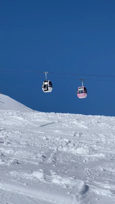 Vintage Ski gondolas over the slopes of Courchevel ski resort, French alps. Stock Footage 337093103