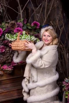 Vintage spring progect. Plus size woman on flower background Stock Photos