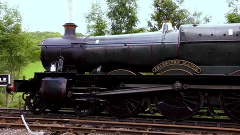 Vintage steam engine  pulling out station Stock Footage 80294128