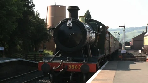 Vintage Steam Train and Carriages Arriving at Station Stock Footage