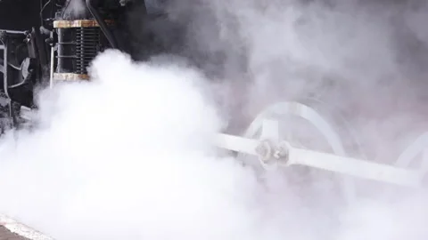 Vintage steam train locomotive. Pair locomotive train leaking smoke, steam Stock-Footage 182965341