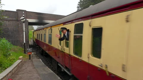 Vintage Steam Train Passing Under Brick Bridge In Gloucester And Warwick Stock Footage 341500101