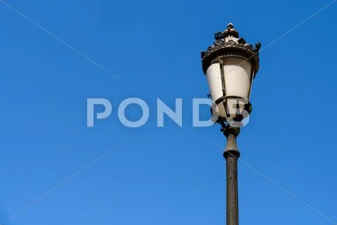 Vintage Street Lamp On Blue Sky Stock Photos