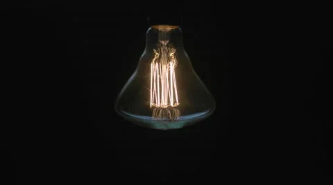 Vintage Style Edison Light Bulb Being Turned On. Stock Footage 65745974