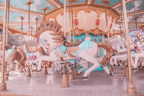 Vintage style empty carousel horse at playground Stock Photos