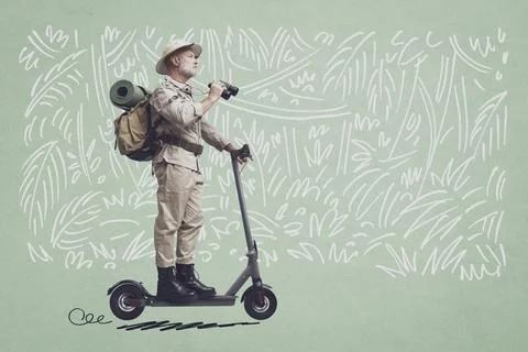 Vintage style explorer riding an e-scooter Stock-Fotos
