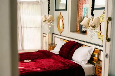Vintage-style interior with pink sofas and an old chandelier Stock Photos