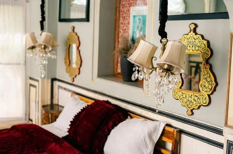 Vintage-style interior with pink sofas and an old chandelier Stock Photos