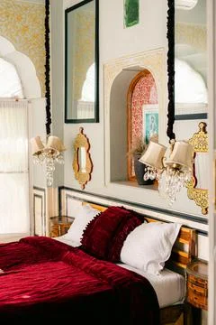 Vintage-style interior with pink sofas and an old chandelier Stock Photos