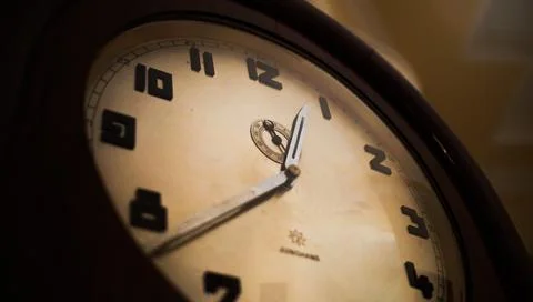 A vintage style of an old clock on the wall Stock Photos