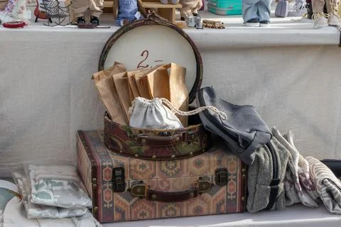 Vintage Style Patterned Suitcases, Packaging Bags, and Textile Pouches Displa Stock Photos