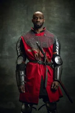 Vintage style portrait of brutal dark skinned man, medieval warrior or knight Stock Photos