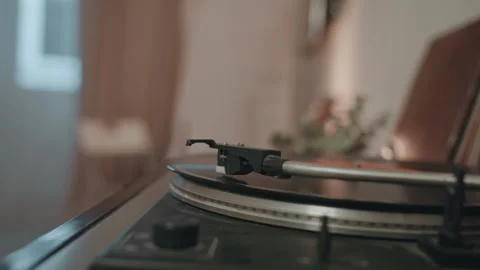 Vintage style turntable with focus on needle and ambient lighting. Quiet moment Stock Footage 342069412