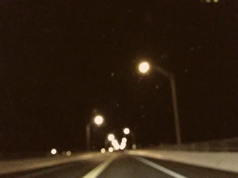 Vintage Stylized Defocused Night Driving Across Bridge Stock Video Stock Footage