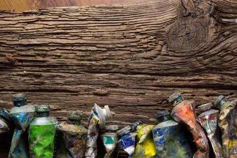 Vintage stylized photo of oil multicolor paint tubes closeup and Stock Photos