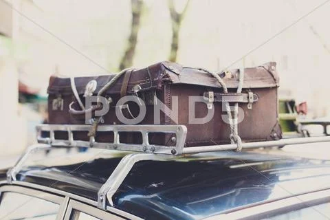 Vintage Suitcase On An Old Car Roof Rack