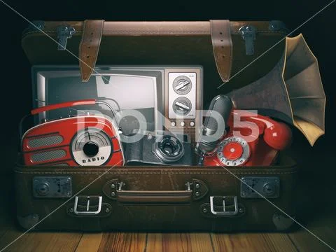Vintage suitcase with old obsolete electronic equipment set. Retro technology Stock-Fotos