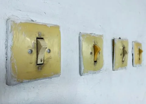 Vintage switch and switch on the wall. Stock Photos