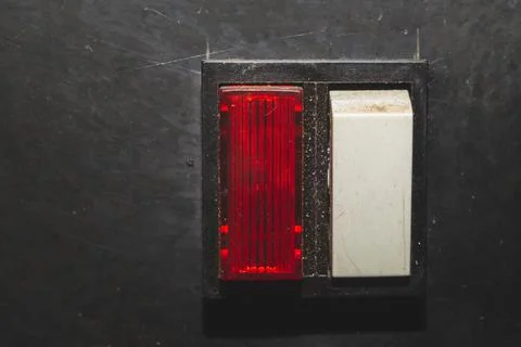 Vintage switch with a red indicator on a black background. white toggle butto Stock Photos