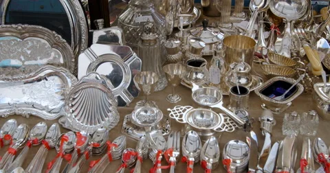 Vintage tableware silver objects at a flee market Stock Footage 68986389