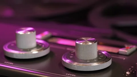 Vintage tape recorder knobs and reels in motion 스톡 동영상 319890921