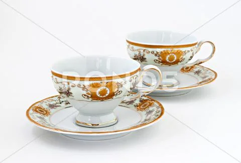 Vintage tea set with gold decor isolated Stock Photos