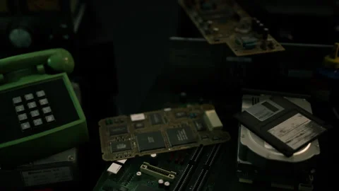 Vintage tech pieces arranged nostalgically on a dark surface Stock Footage 307285038