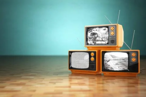Vintage television concept. Stack of retro tv set on green background. Vin... Stock Photos