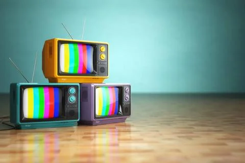 Vintage television concept. Stack of retro tv set on green background. Vin... Stock Photos