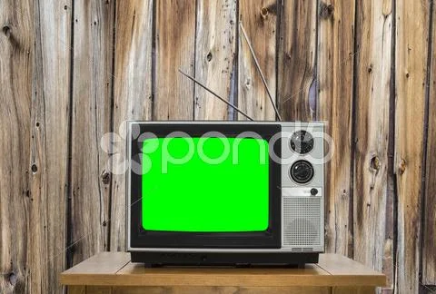 Vintage Television With Old Wood Wall And Chroma Screen