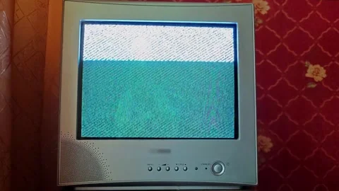 Vintage television screen showing interference patterns in a home setting Stock Footage 341619687
