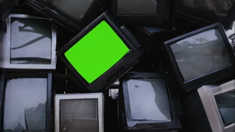 Vintage Television Stack Green Screen Retro TV Tilt Down Pile of Monitors Stock Footage 256298395