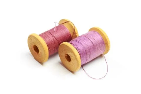 Vintage thread spools isolated on a white Foto stock