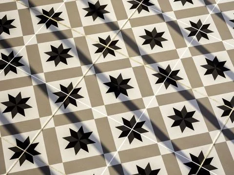 Vintage tile floor pattern with black, white and beige colors. Geometric patt Stock Photos