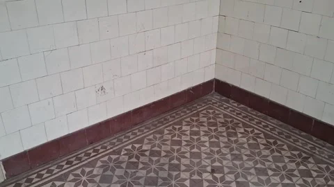 Vintage tiled room corner featuring geometric patterns Stock Footage 345975582