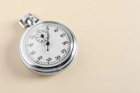 Vintage timer on beige background, space for text. Measuring tool Stock Photos