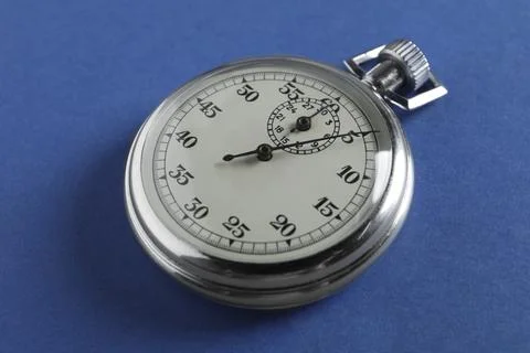 Vintage timer on blue background. Measuring tool Foto stock