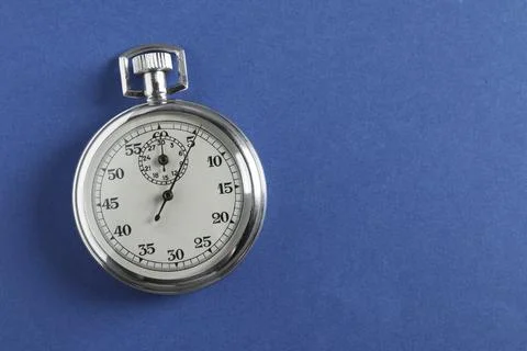 Vintage timer on blue background, top view with space for text. Measuring too Stock Photos