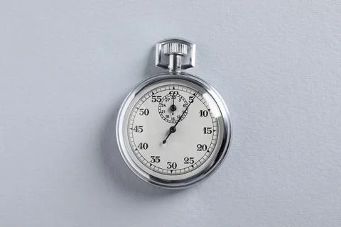Vintage timer on light grey background, top view. Measuring tool Foto stock
