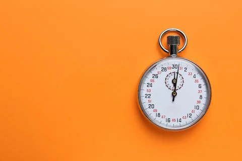 Vintage timer on orange background, top view. Space for text Stock Photos