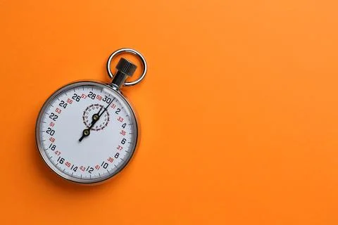 Vintage timer on orange background, top view. Space for text Stock Photos
