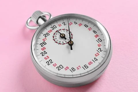 Vintage timer on pink background. Measuring tool Stock Photos