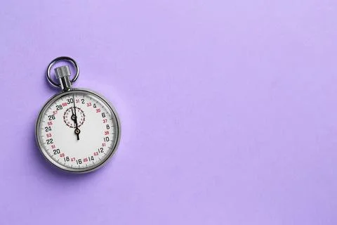 Vintage timer on violet background, top view. Space for text Stock Photos