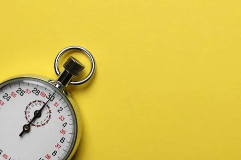 Vintage timer on yellow background, top view. Space for text Stock Photos
