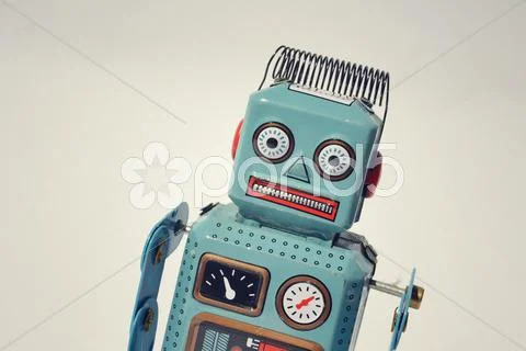 Vintage tin toy robot isolated on white background, filtered retro photo Stock-Fotos
