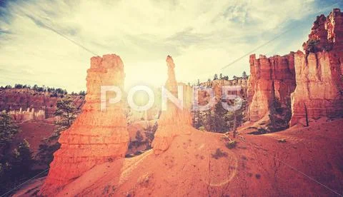 Vintage toned sunset in Bryce Canyon with lens flare effect Stock Photos