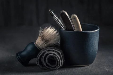 Vintage tools for barber. Sharp razor, soap and brush Stock Photos