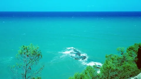 Vintage top down view of turquoise sea waves crashing on a submerged reef rock Stock Footage 341360460