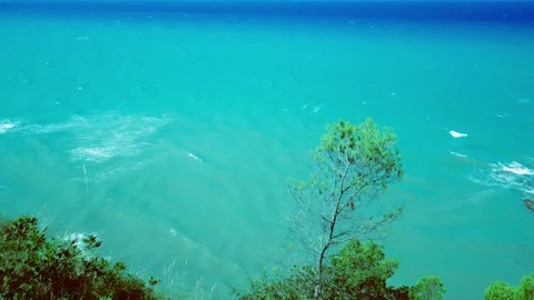 Vintage top down view of turquoise sea waves crashing on a submerged reef rock Stock Footage 341360470