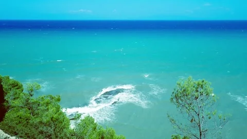 Vintage top down view of turquoise sea waves crashing on a submerged reef rock Stock Footage 341361619